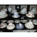 2 shelves of interesting cups and saucers