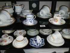 2 shelves of interesting cups and saucers