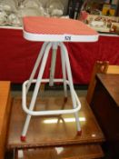 An adjustable kitchen stool