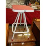 An adjustable kitchen stool