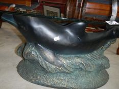 An oval dolphin table