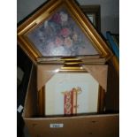 A box of various framed and glazed pictures
