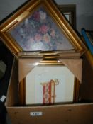 A box of various framed and glazed pictures