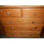 A 2 over 3 pine chest of drawers
