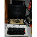 A vintage Antler briefcase and a vintage Silver Reed 500 typewriter