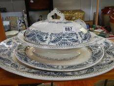 A lidded tureen with two graduated platters (largest approximately 18 x 4.