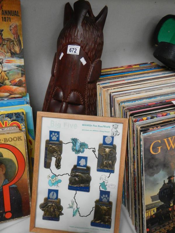 A 1970s Senegal West Africa carved mask and framed and glazed Big Five Winning Trophy from Free