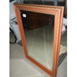 A rectangular bevelled mirror