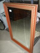 A rectangular bevelled mirror