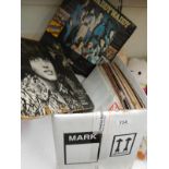 A box containing a quantity of LP records and 45's