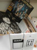 A box containing a quantity of LP records and 45's