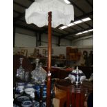 A mahogany standard lamp