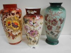 3 good Victorian hand painted vases 12" to 14" tall, in good condition.