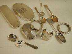 A mixed lot of silver lids for glass bottles etc., silver spoons etc.