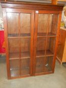 A good oak 2 door bookcase, high, in good condition.