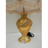 A good modern gilded table lamp with fringed shade, 28" tall.