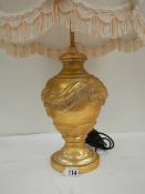 A good modern gilded table lamp with fringed shade, 28" tall.