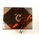 An imitation tortoise shell box with silver mounts (two small strips missing,