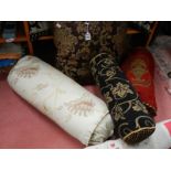 A quantity of 20th century bolster cushions, door draft excluder etc.
