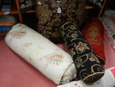 A quantity of 20th century bolster cushions, door draft excluder etc.