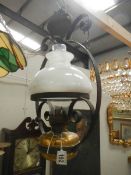 An early 20th century hanging oil lamp, complete.