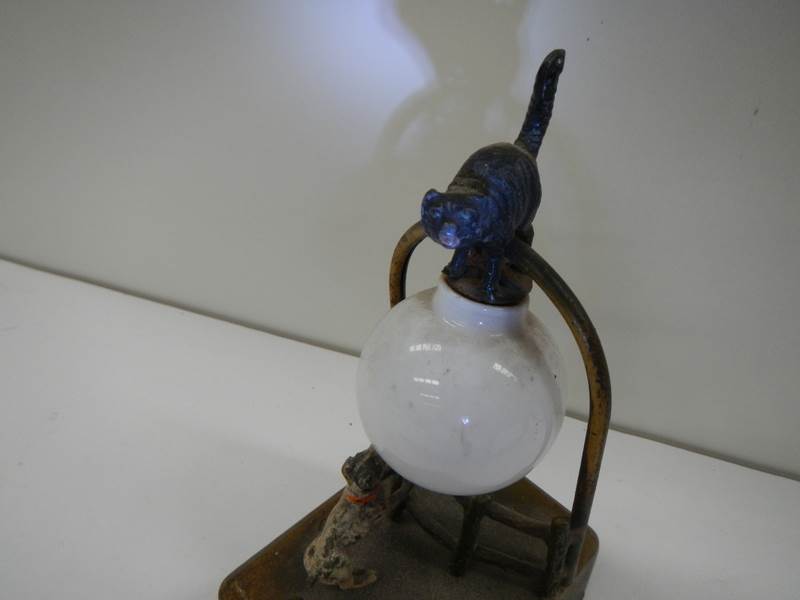 A vintage bedtime light depicting a dog watching a cat that is balanced on the shade, - Image 3 of 5