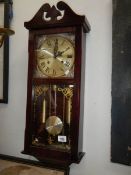 A late 20th century wall clock, in working order.