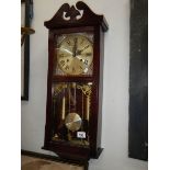 A late 20th century wall clock, in working order.