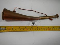 An old copper hunting horn in good condition.