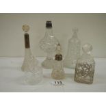 6 old perfume bottles, some with silver tops.