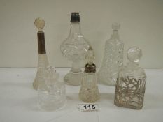 6 old perfume bottles, some with silver tops.