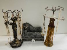 2 jewellery display figures and a jewellery box in the shape of a chaise longue.