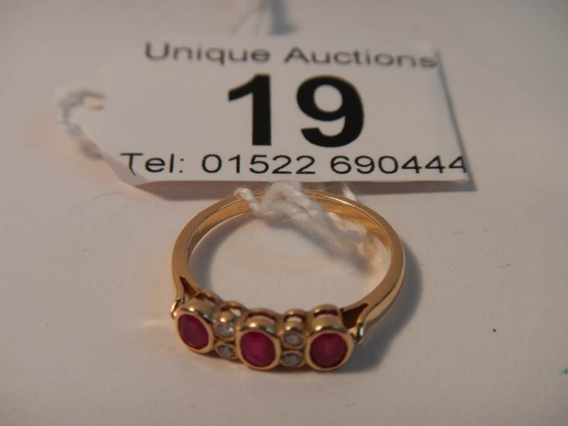 An 18ct gold diamond and ruby ring,