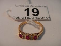 An 18ct gold diamond and ruby ring,