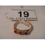 An 18ct gold diamond and ruby ring,