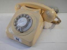 An old cream telephone converted for use.