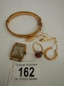 A mixed lot of gold items including ruby ring, earrings etc.