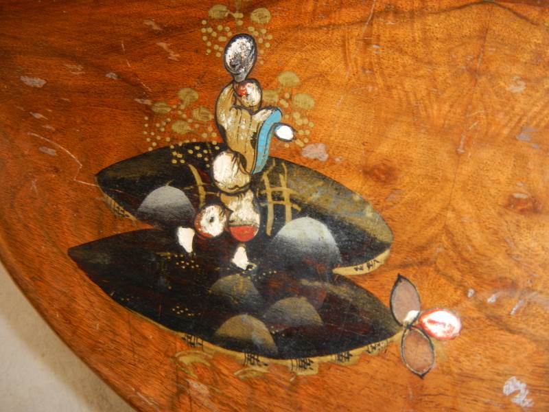 A small oval mahogany table with lacquered pictures, on ball and claw feet, in fair condition. - Image 4 of 4