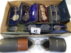 8 pairs of vintage spectacles in cases, possibly some gold but none marked.