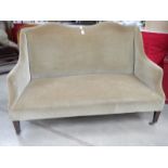 An old French style couch on square legs and with brass castors, in good condition.