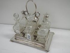 A good Victorian 6 bottle cruet with cut glass bottles.