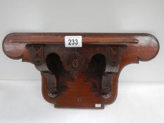 A Victorian mahogany clock bracket, 23" wide x 11.5" high.