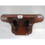 A Victorian mahogany clock bracket, 23" wide x 11.5" high.