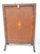 An Edwardian inlaid fire screen with original handle.