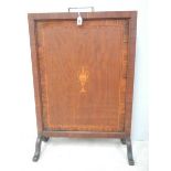 An Edwardian inlaid fire screen with original handle.