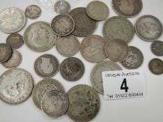 A mixed lot of British pre 1947 silver coins, approximately 198 grams,