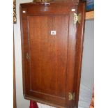 A Victorian oak hanging corner cupboard.