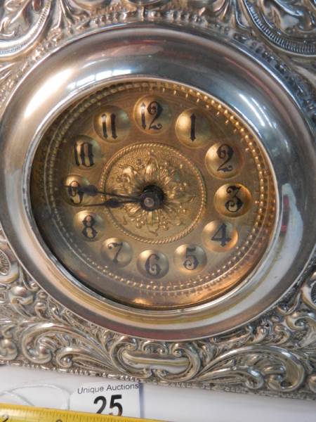 A good quality embossed silver plated mantel clock in good working order (8" wide x 8" high). - Image 2 of 4