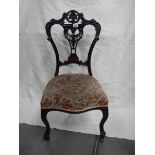 A Victorian carved nursing chair,