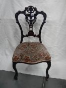 A Victorian carved nursing chair,